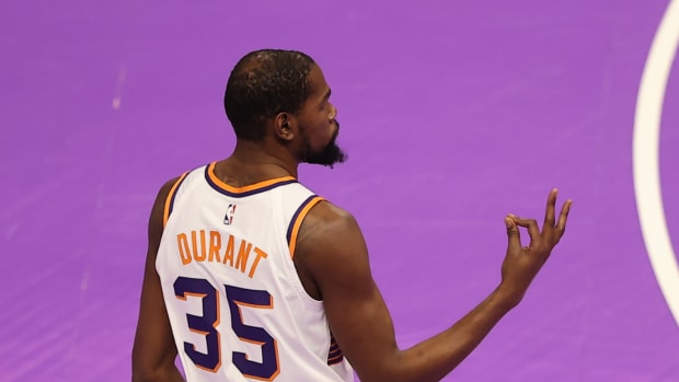Phoenix Suns forward Kevin Durant (35) reacts to making a three point shot against the Utah Jazz in the first quarter at Delta Center.